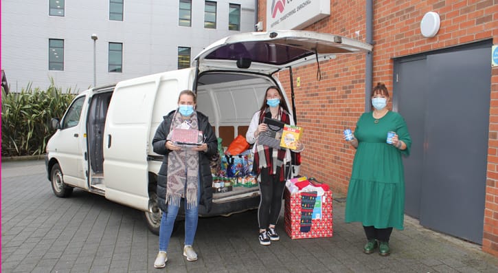 SERC Staff and Students with food donation items outside SERC Lisburn